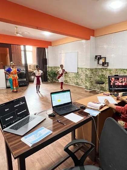 We bridge distances with our hybrid learning model. This image shows how I conduct a practical examination for both our in-person students at the Bangalore center and our online students joining from different locations. Our technology setup ensures every student receives equal attention and guidance.