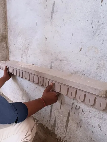 True design is born from craftsmanship. Here, a local artisan carefully places a hand-carved piece of Chunar sandstone, a detail that embodies my commitment to using regional materials and traditional techniques to give a space its authentic soul.