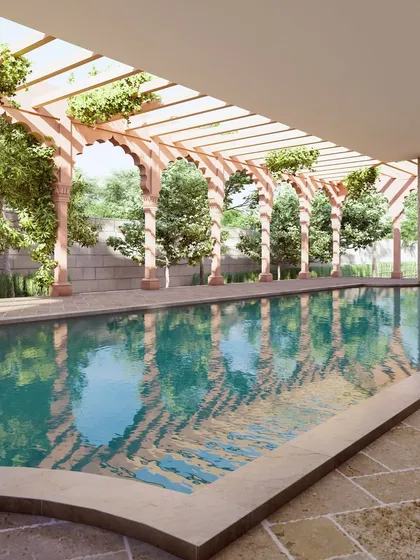 This serene swimming pool at the Banaras haveli is framed by traditional red sandstone arches and a wooden pergola. It represents our ability to blend modern leisure with heritage architectural forms, creating a tranquil escape that feels both luxurious and historically grounded.