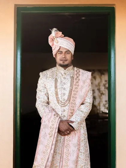 A groom's portrait is just as important as the bride's. I focus on capturing the groom looking his absolute best, highlighting the elegance of his traditional wedding attire.