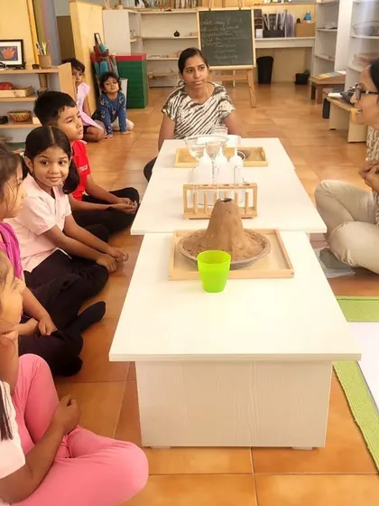 For our elementary children, learning takes on new dimensions. Here, a group gathers for a hands-on science experiment, sparking curiosity about the universe. We use storytelling and discovery to explore big concepts like the Big Bang and the emergence of life.