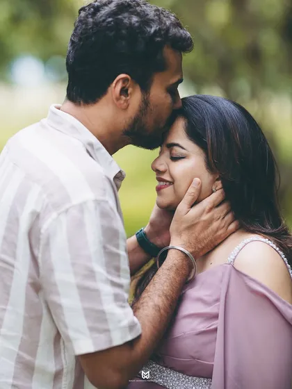 A quiet moment of connection. This close-up shot during an outdoor session captures the pure love and anticipation between partners, a memory to cherish forever.