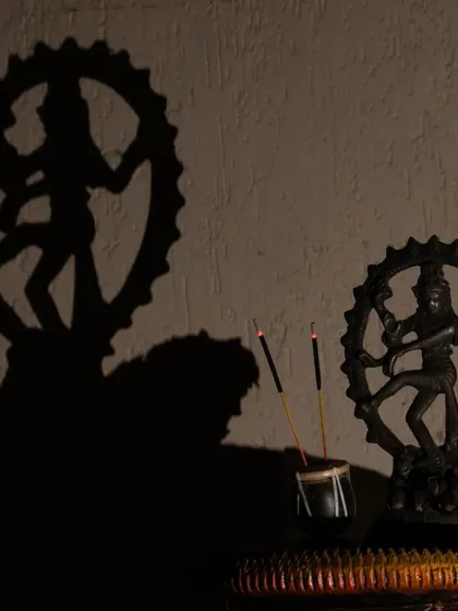 The dance of Lord Shiva as Nataraja, captured here in silhouette, symbolizes the cosmic cycles of creation and destruction. I use such profound symbols in my consultations to explain the deeper spiritual truths that govern our lives and help you find balance amidst life's changes.