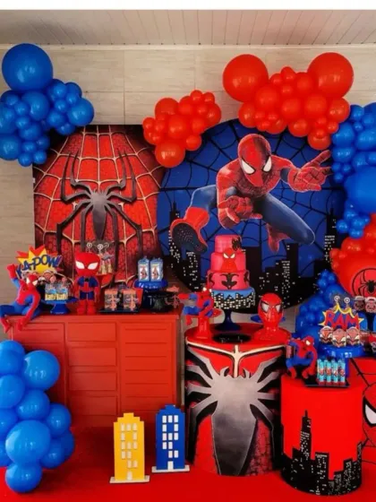 An action-packed Spider-Man themed birthday party. This full-scale decoration includes multiple character backdrops, themed dessert tables and stands, and balloon arrangements in the classic red and blue colors.