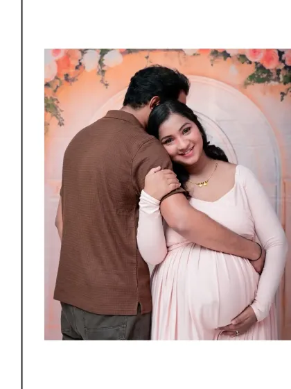 The connection between partners during this time is so special. This is a tender, quiet moment of anticipation and love, captured against a soft, dreamy floral archway. It’s these unscripted embraces that often make for the most cherished pregnancy portraits.