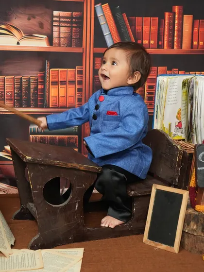How cute is this 'Back to School' theme for a toddler's photoshoot? With a vintage-style desk, a backdrop of books, and this little one's joyful expression, we created a playful and memorable scene. I have lots of fun props to bring any creative idea to life.