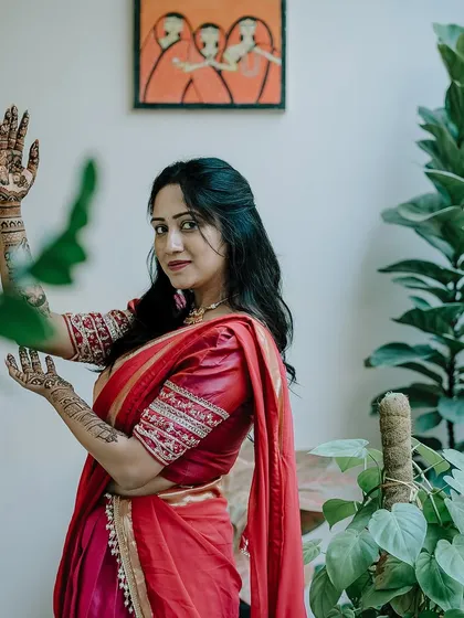 A graceful pose from the same client, her hands decorated with my designs, adding to the elegance of the moment.