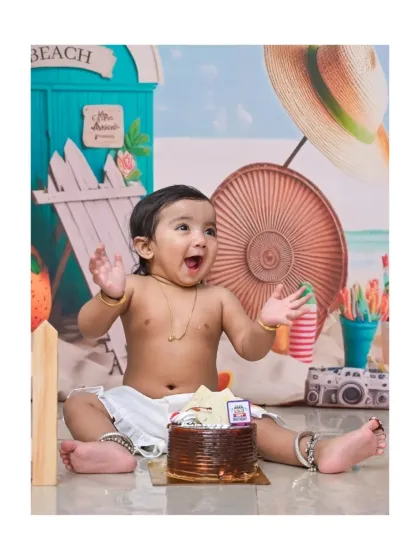 The excitement is real in this beach-themed cake smash. The look of pure delight before digging into the cake is one of my favorite moments to capture during a first birthday session.