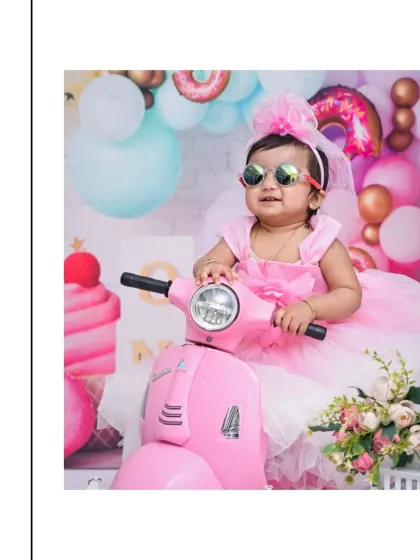 For this Candy Land themed shoot, we brought in a stylish pink scooter. I love incorporating fun props like this to bring a theme to life and capture your baby's personality.