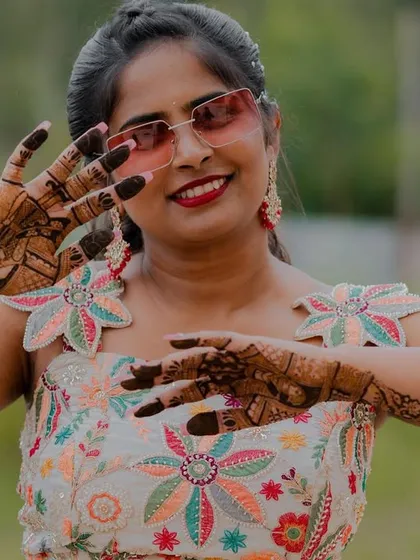A fun and stylish shot of the bride showing off her henna. Her personality shines through!
