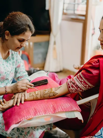 Another angle of me working on a bridal design. I always ensure my clients are comfortable and relaxed during the hours-long application process.