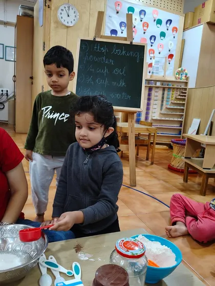 Practical life skills are the foundation of independence. In this group baking activity, children are learning so much more than just a recipe. They practice reading instructions, measuring ingredients, and developing patience, all while working together.